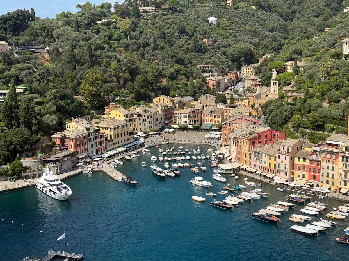 Colorful buildings and boats in Genoa harbor, Italy